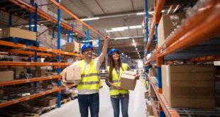 One male and a female staff in a warehouse